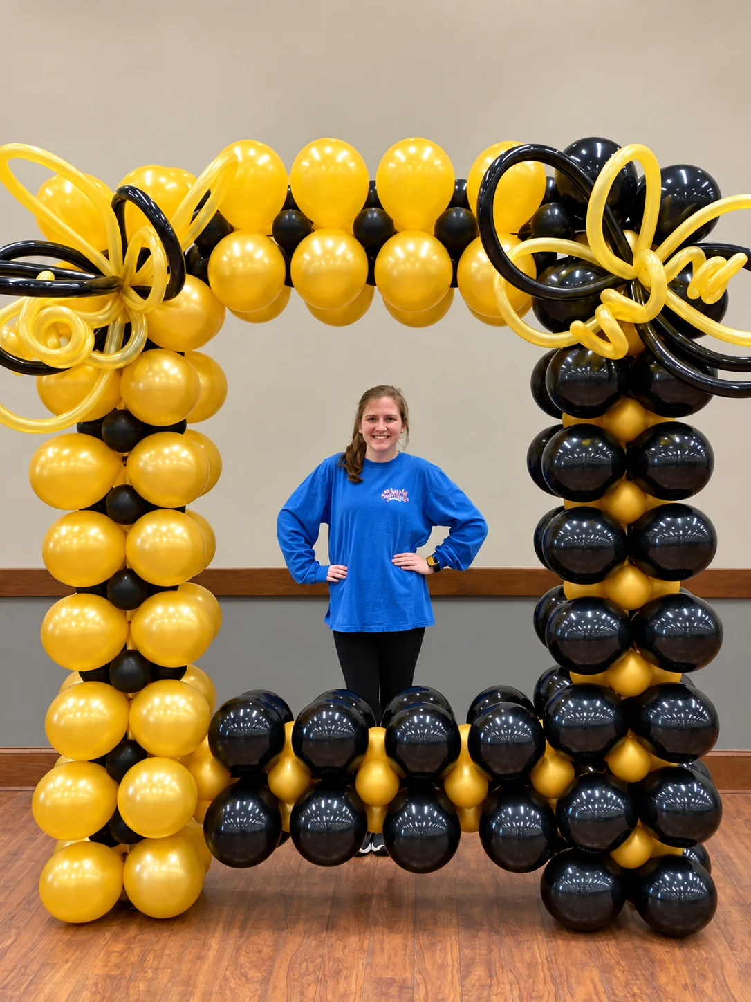 Black and gold balloon photo frame with decorative twists