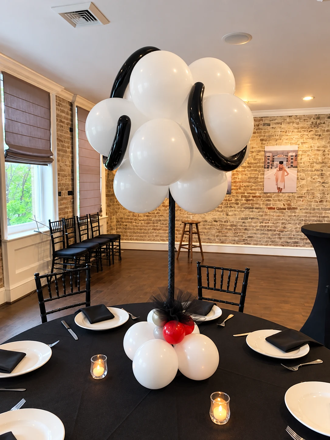 Soccer themed balloon centerpiece on a dinner table