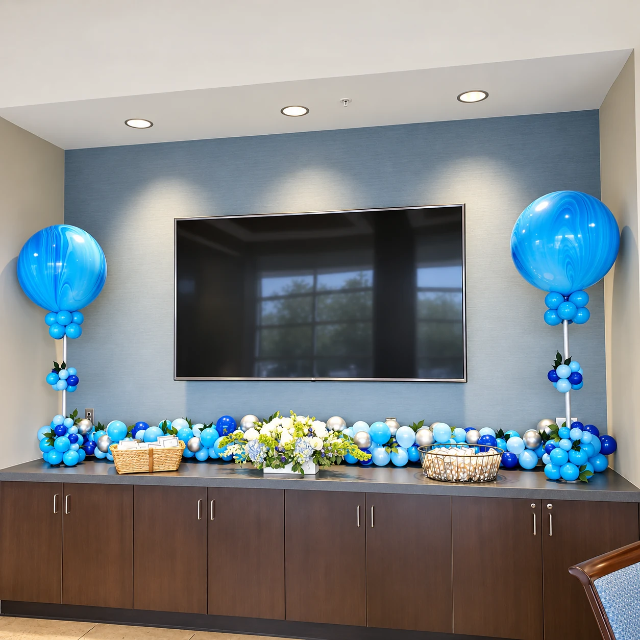 Blue balloon display with tabletop garland and floating accents