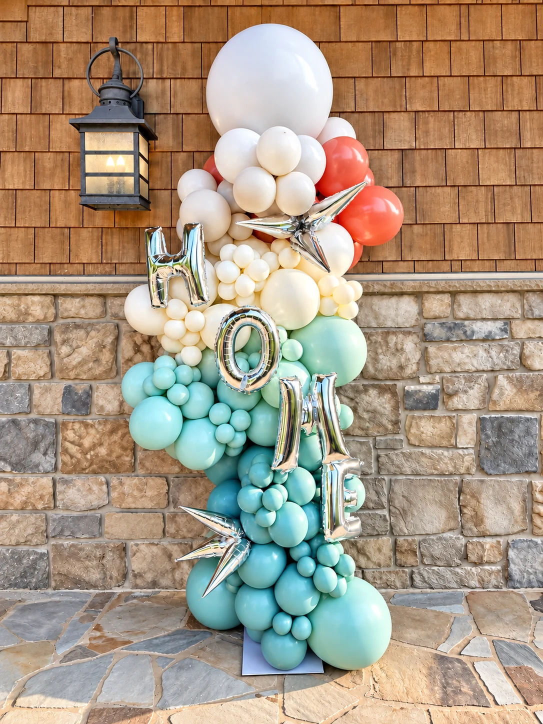 Blue, white and silver graduation balloon column with cap topper