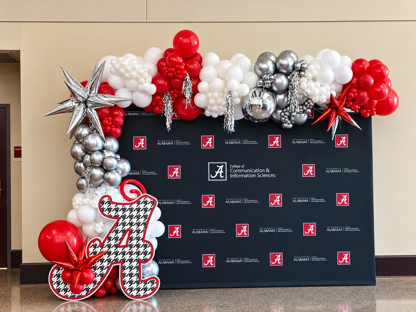 Crimson, white and silver university anniversary balloon backdrop