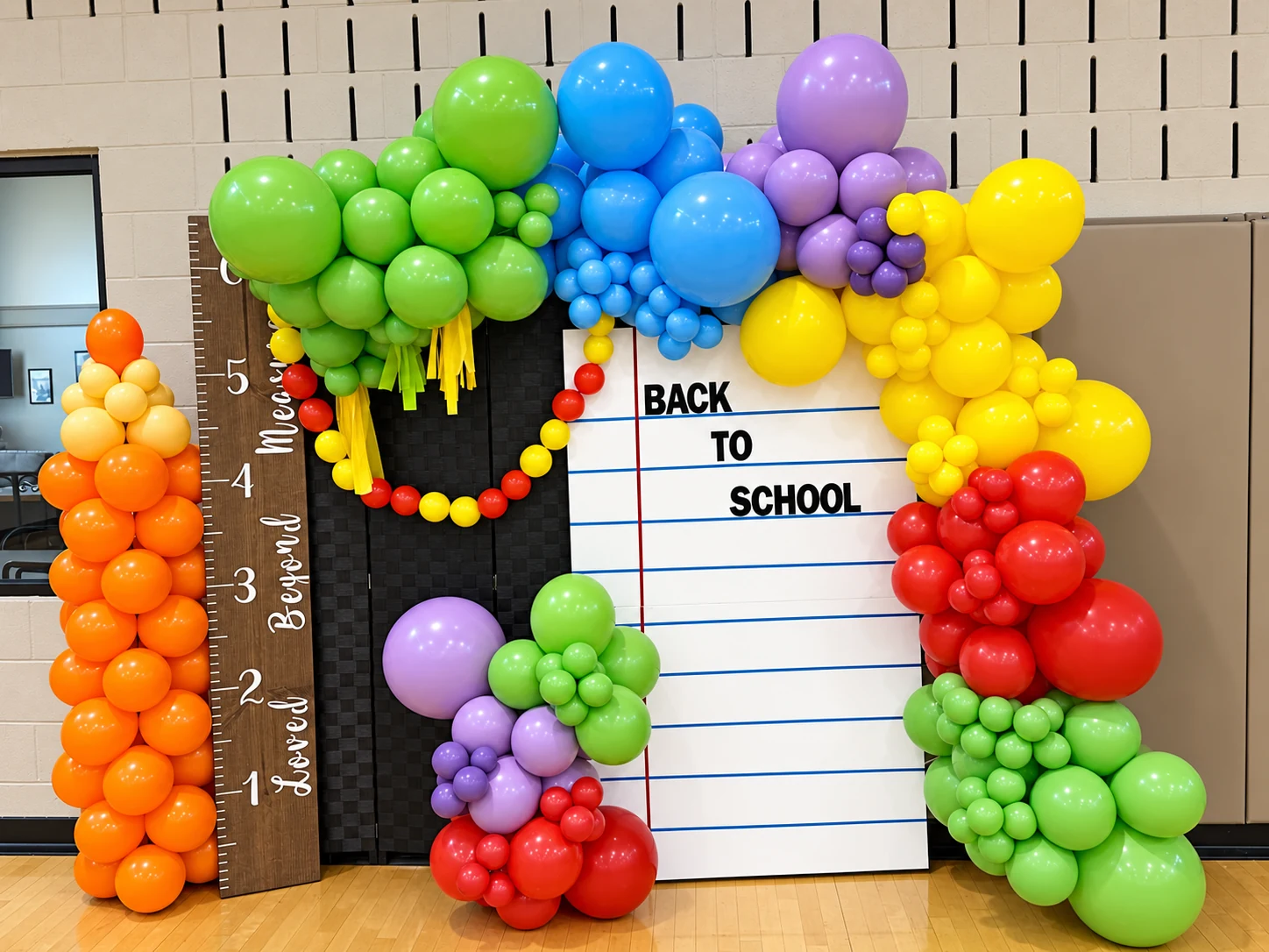 Rainbow back-to-school balloon photo display