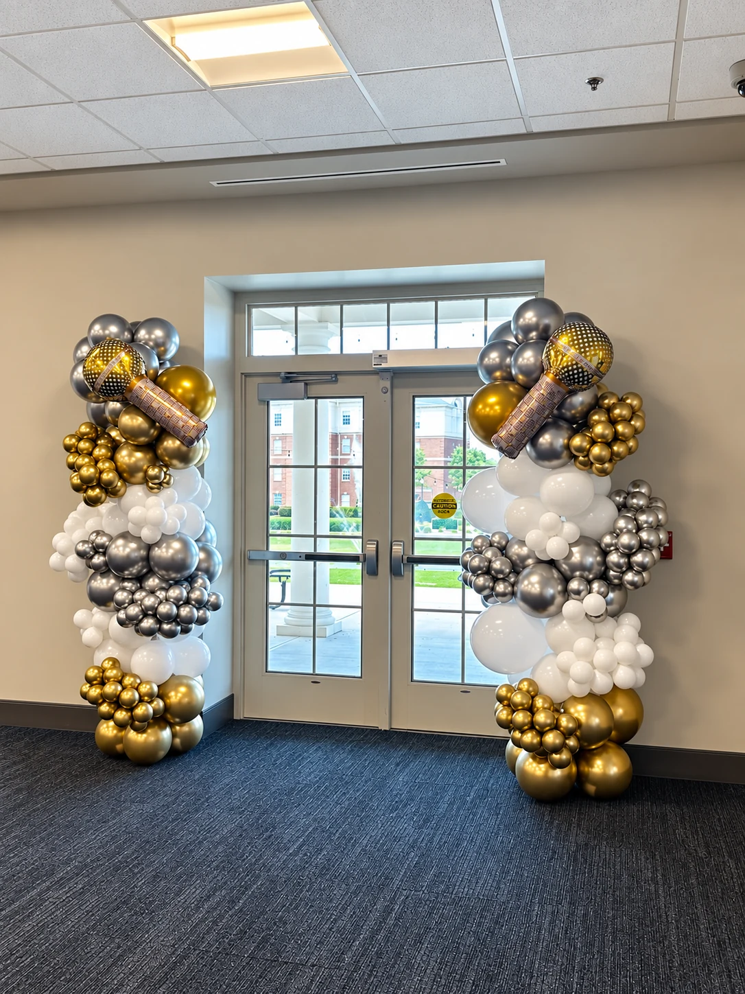 Pair of black, gold and silver organic balloon columns