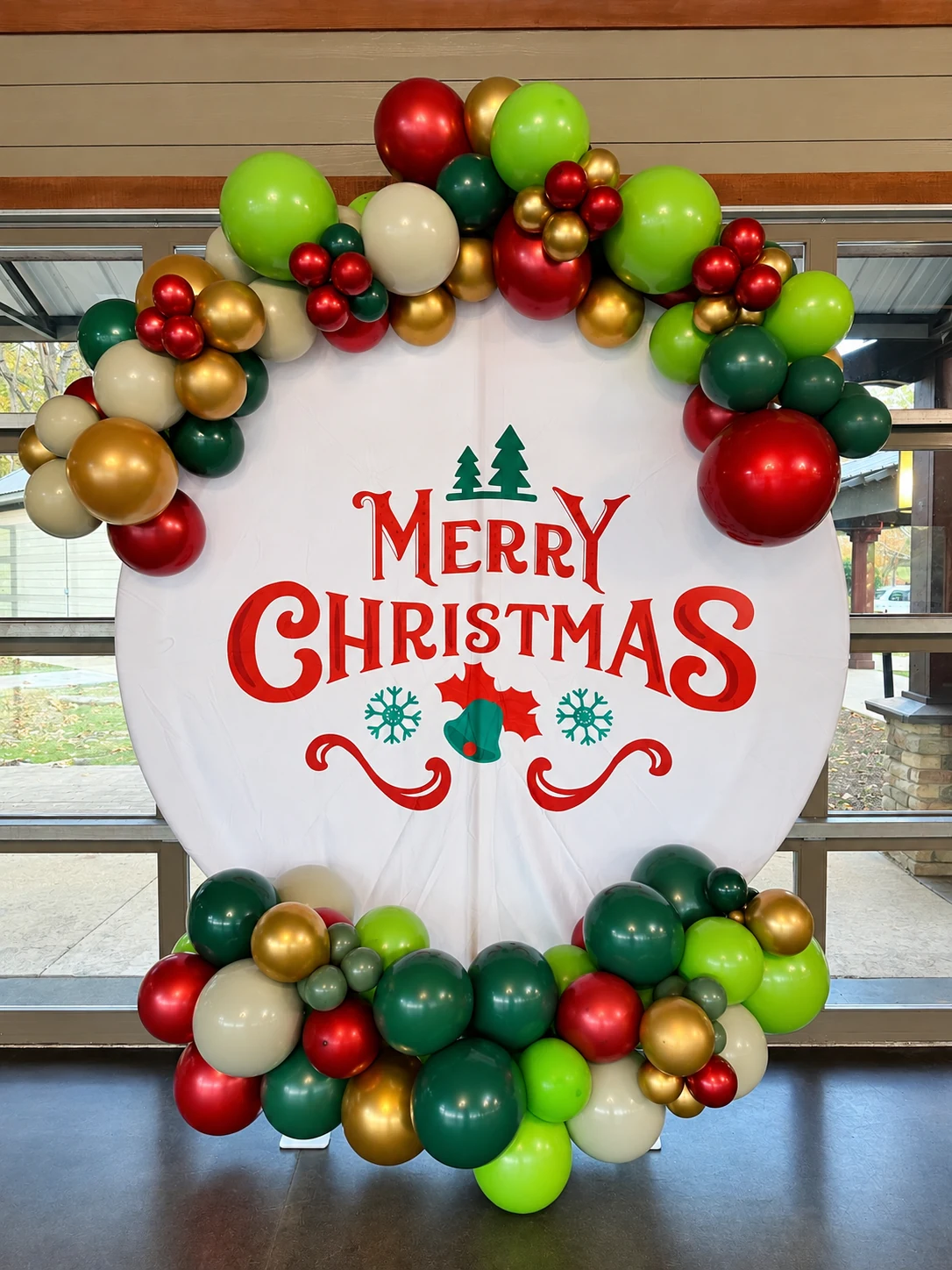 Merry Christmas balloon photo backdrop in red, green and gold