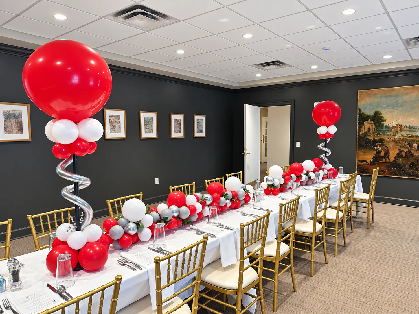 Crimson and white balloon table garland with coordinating large balloons