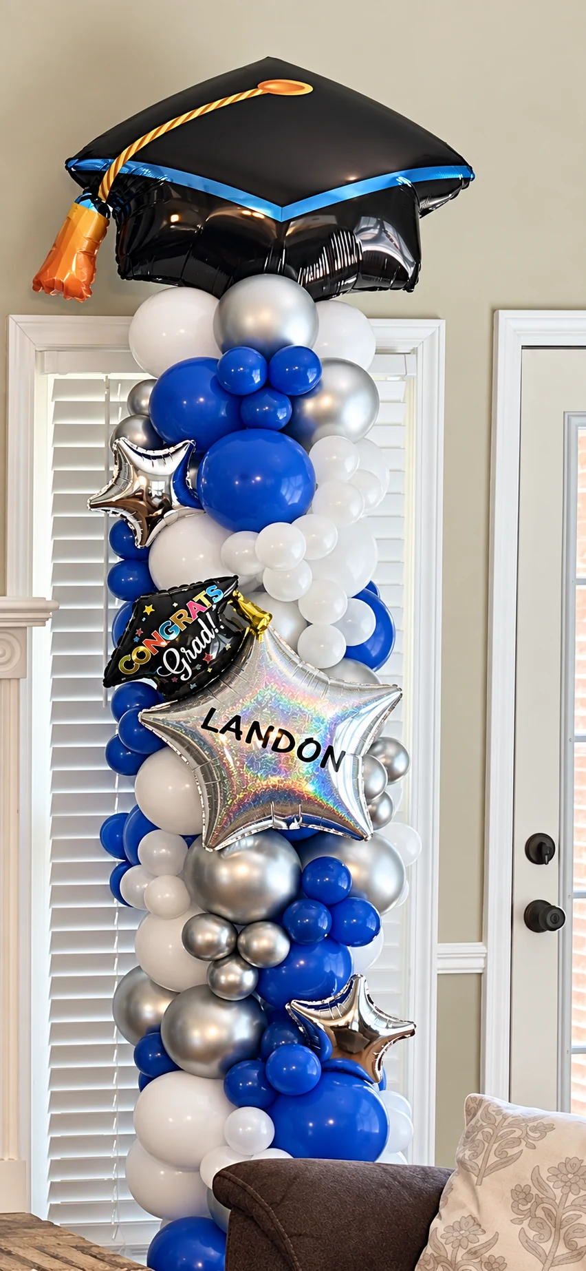Personalized blue, silver and white graduation balloon column