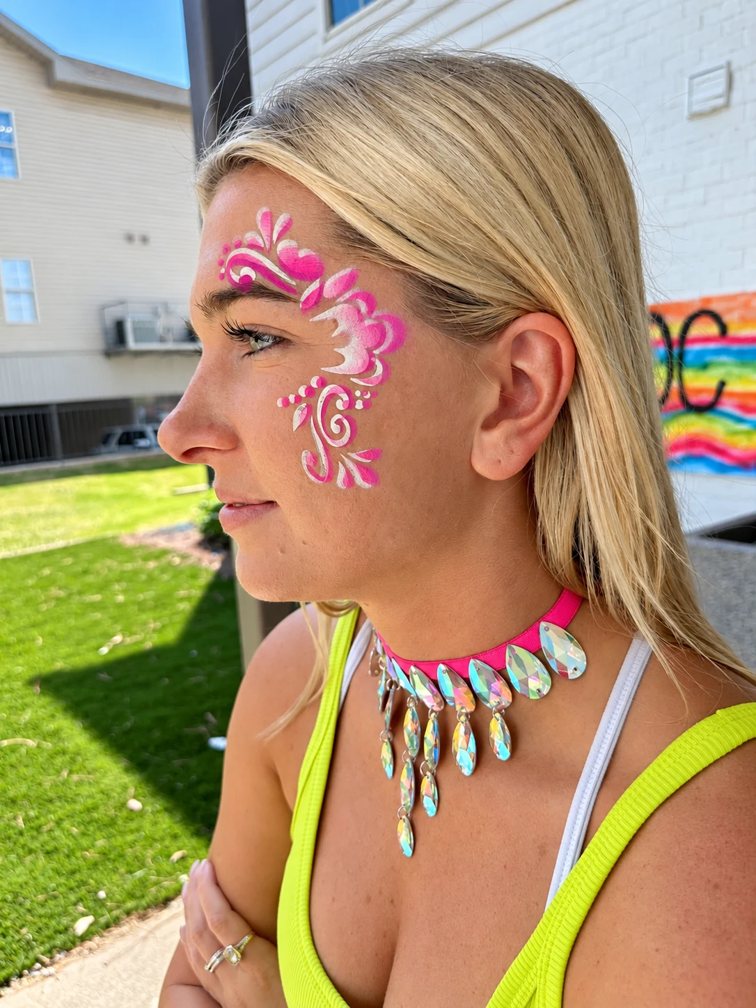Pink floral and swirl face-painting design