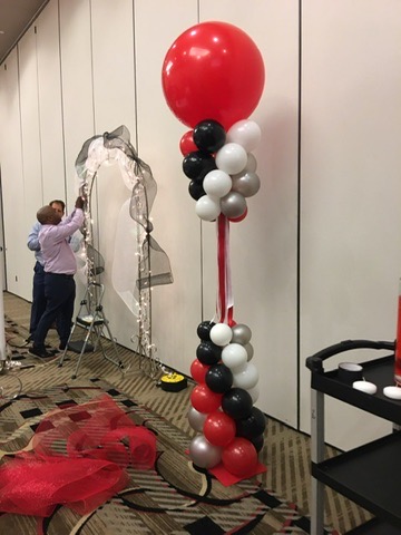 Red, black and silver balloon column