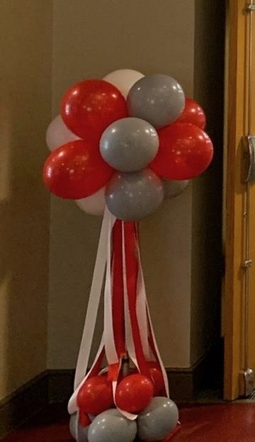 Red, white and silver balloon column with ribbon streamers