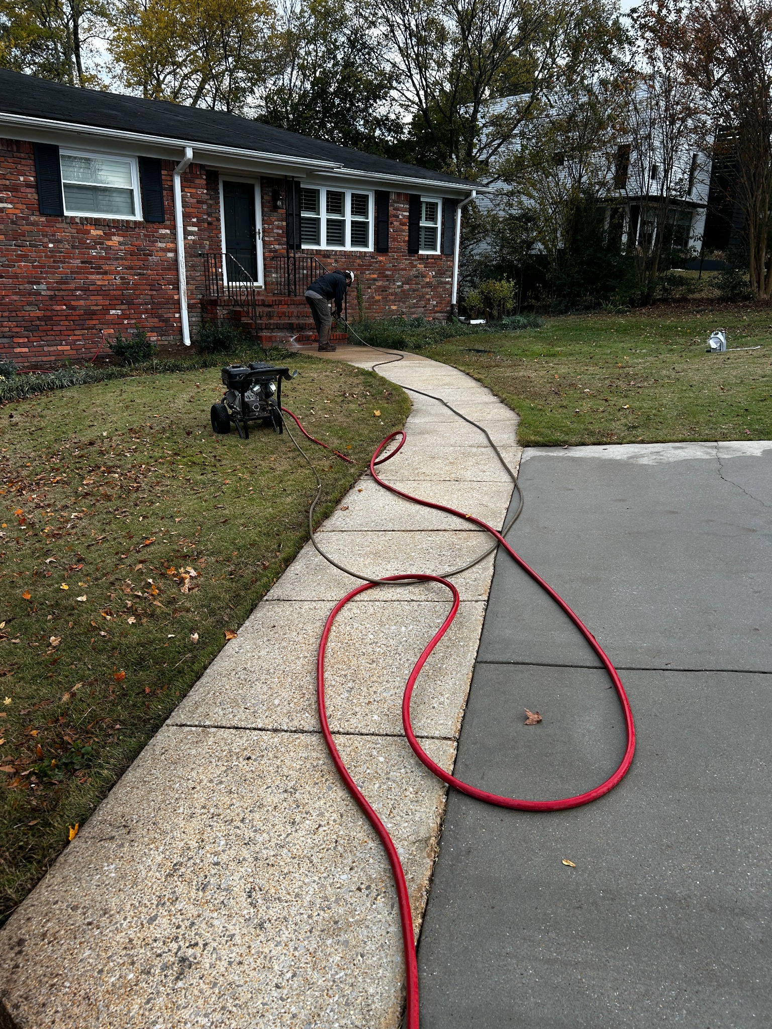 Pressure Point Services cleaning a residential walkway and driveway