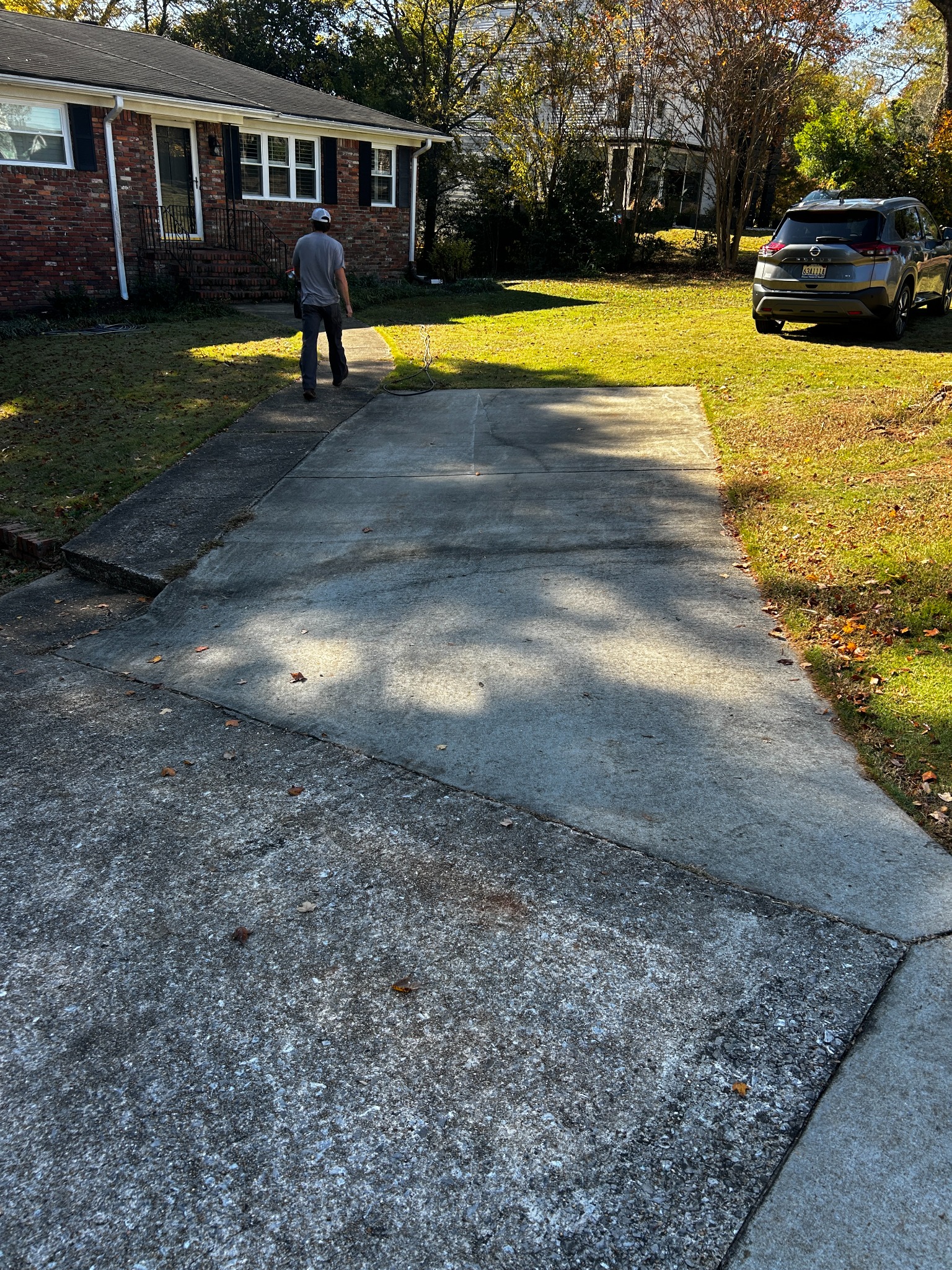 Driveway before pressure washing