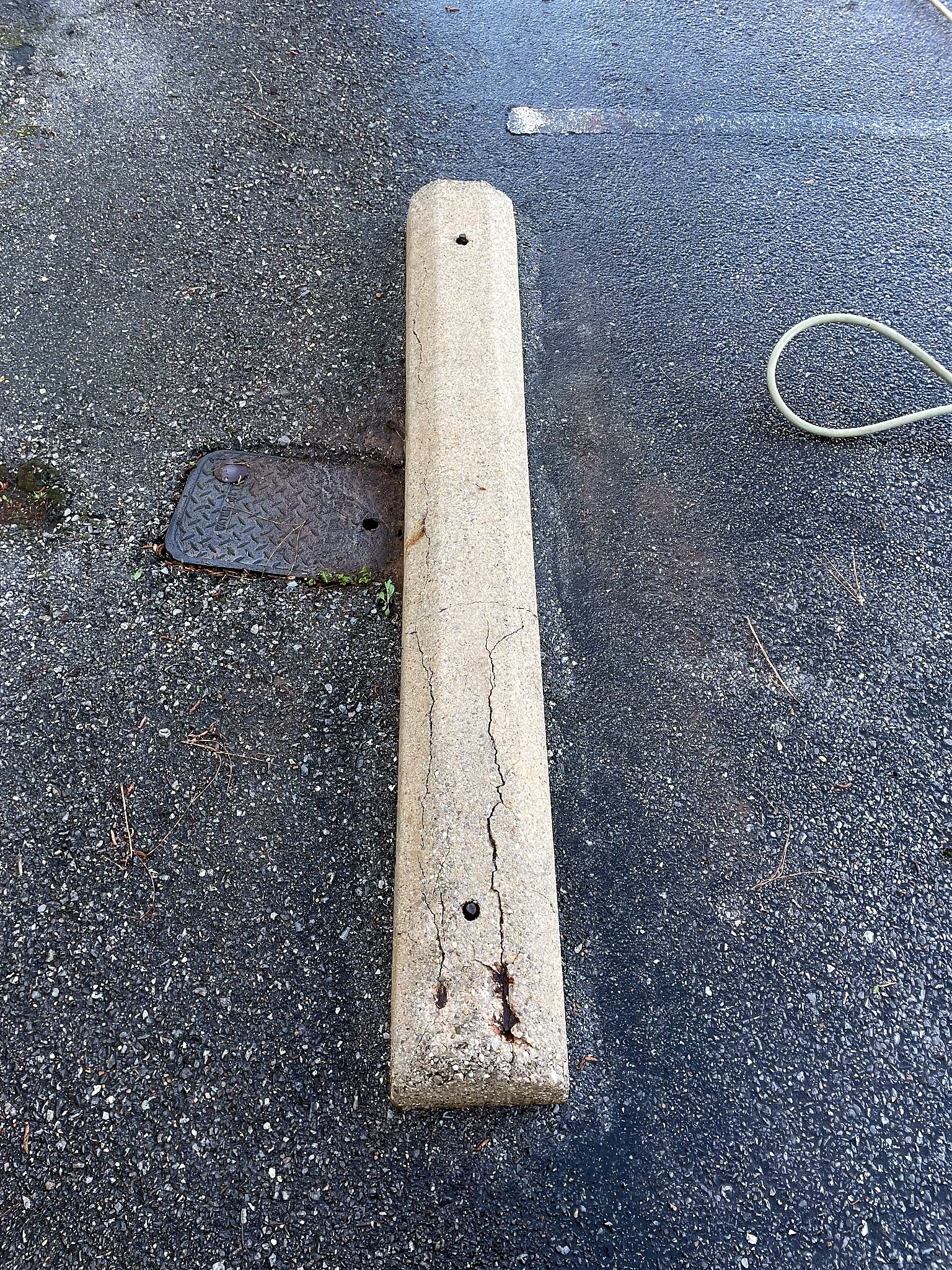 Clean concrete parking curb after pressure washing by Pressure Point Services